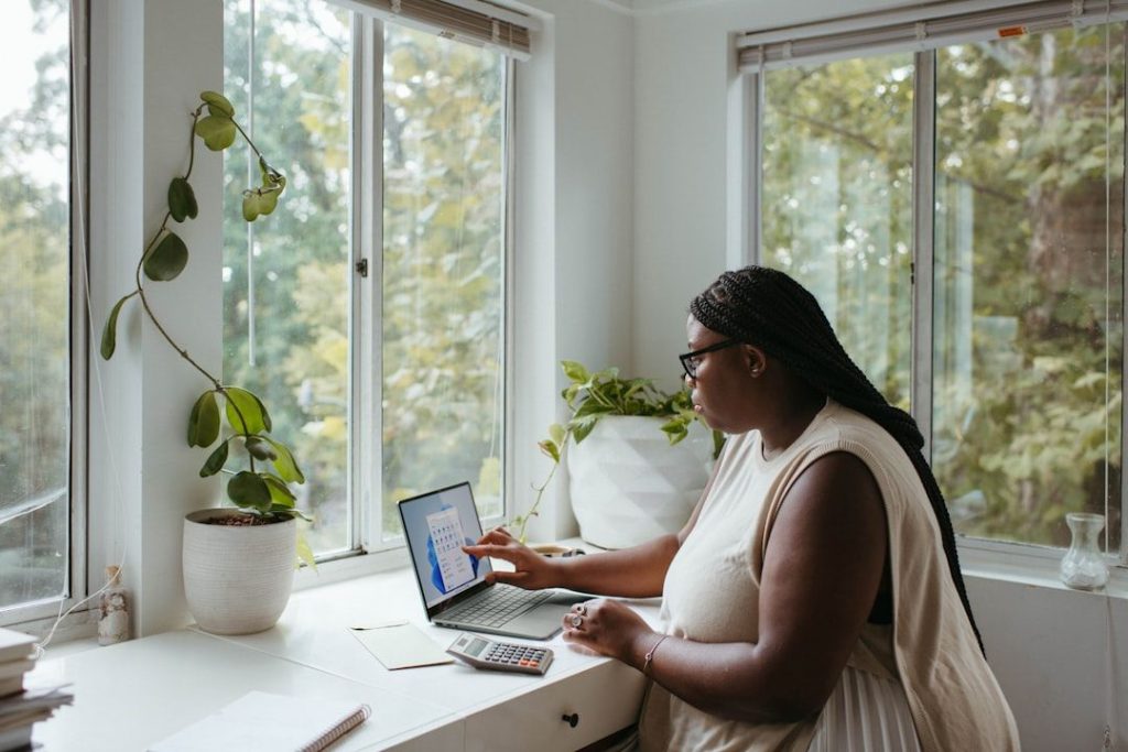 Lady working from her home office which she can claim a portion of costs for tax purposes